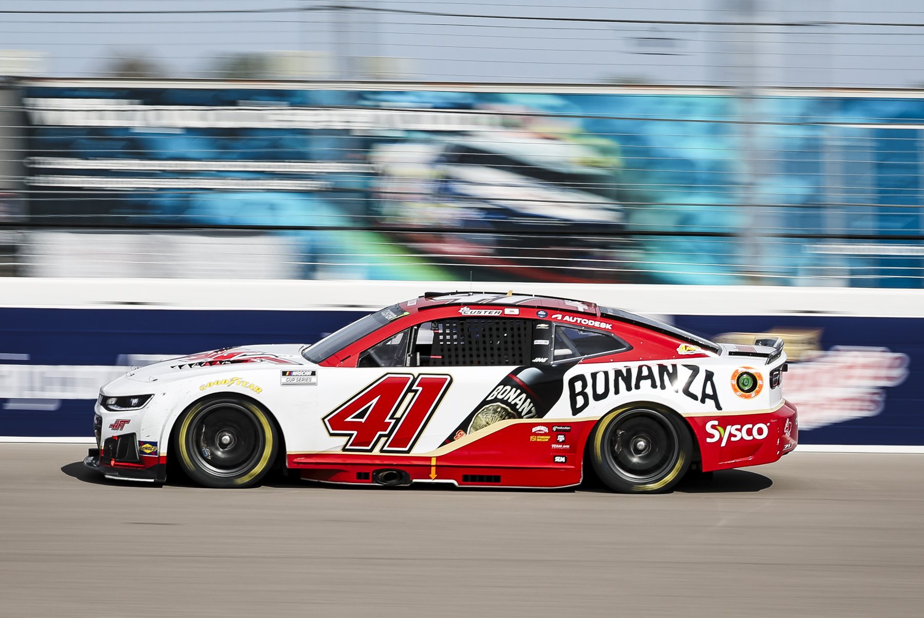 The red and white Bonanza Wines No. 41 Chevrolet at speed along the wall at WWT Raceway
