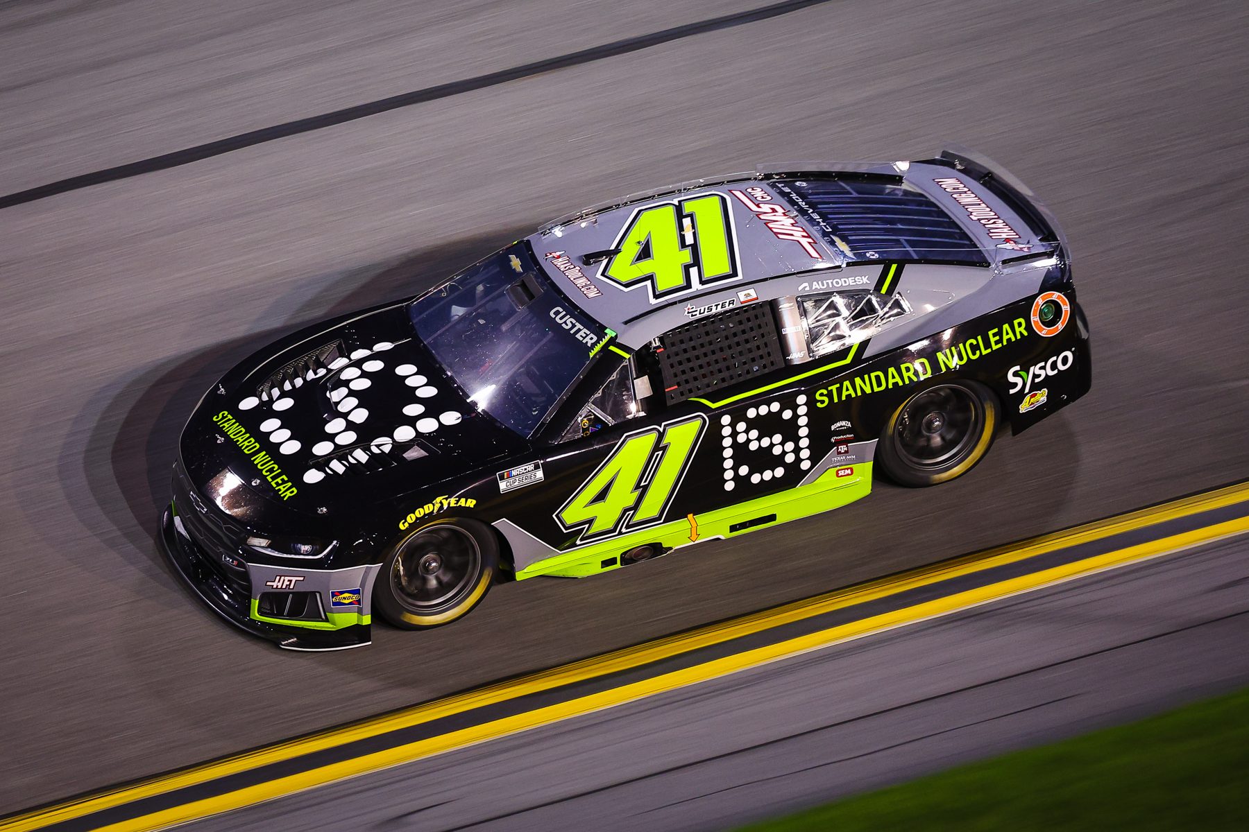 The Standard Nuclear No. 41 Chevrolet at speed at Daytona International Speedway, seen from above