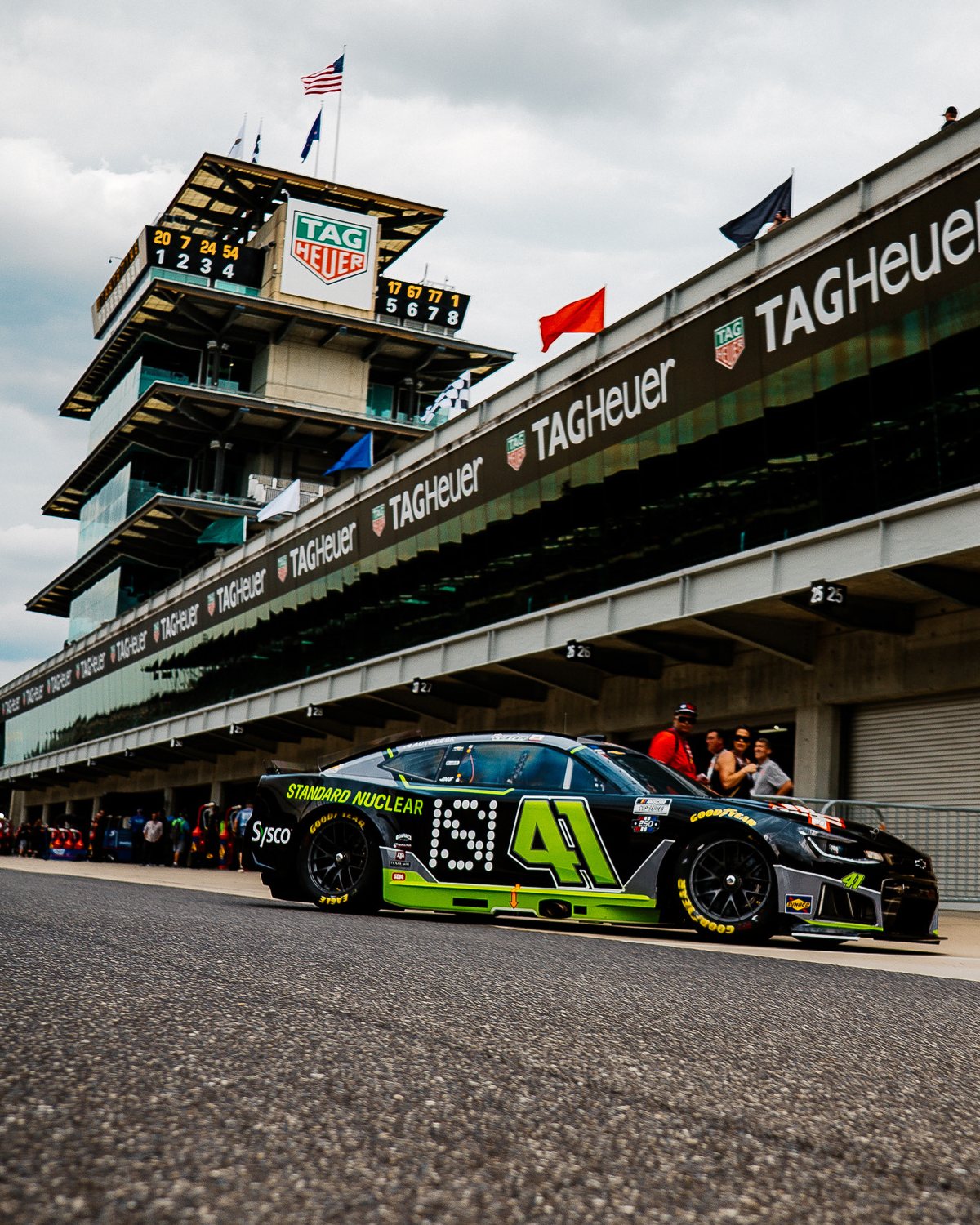 The black and green Standard Nuclear No. 41 on pit road beneath the Pagoda at Indianapolis Motor Speedway